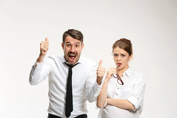 Successful business couple at the office looking at camera — Stock Photo, Image