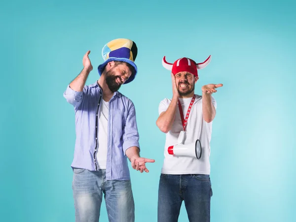 The two football fans over blue — Stock Photo, Image