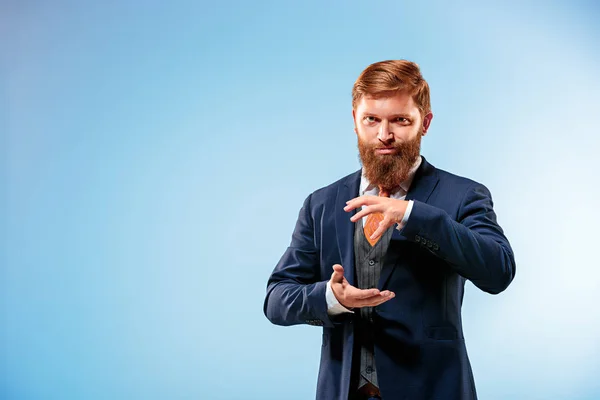 Portrait of a business man isolated on blue background. — Stock Photo, Image