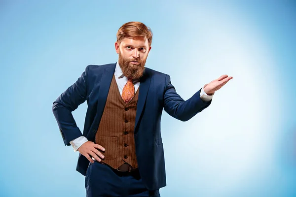 Portrait of a business man isolated on blue background. — Stock Photo, Image