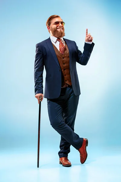 The barded man in a suit holding cane. — Stock Photo, Image