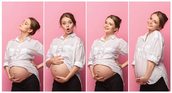 Young beautiful pregnant woman standing on pink background — Stock Photo, Image