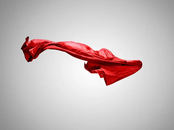 Smidig elegant transparent röd tyg separerade på grå bakgrund. — Stockfoto