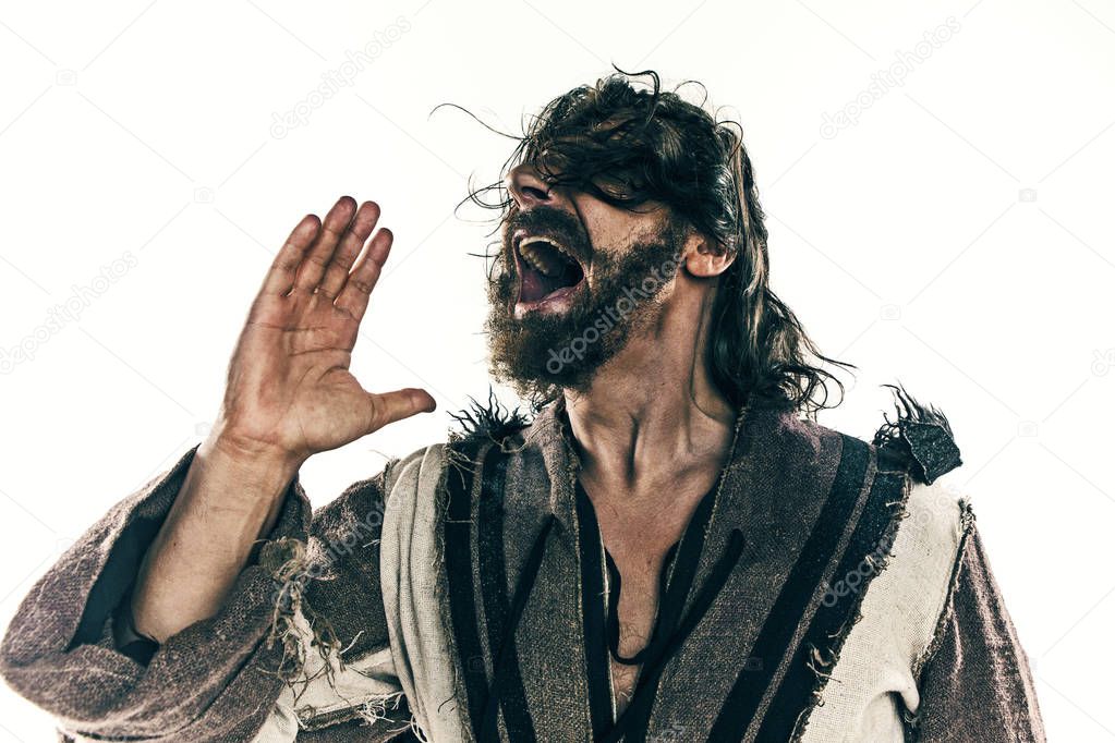 Portrait of a brutal bald-headed viking in a battle mail posing against a white background.