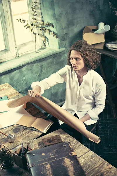 Architect working on drawing table in office — Stock Photo, Image