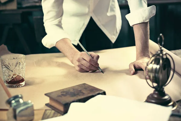 Architect working on drawing table in office — Stock Photo, Image