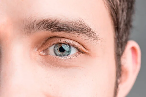 The conceptual image of digital eye of a young man and eoman — Stock Photo, Image