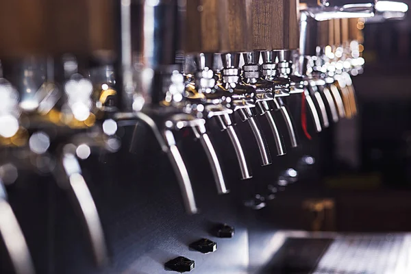 Beer taps in a pub — Stock Photo, Image