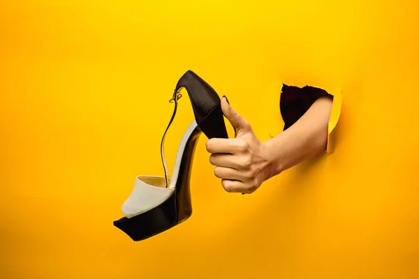 Brown woman shoe on hand isolated — Stock Photo, Image