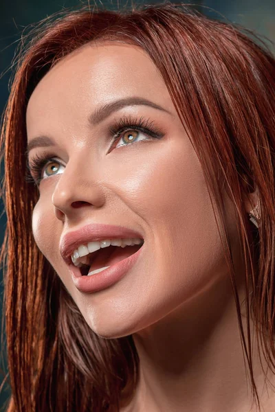 Beautiful woman face portrait close up on dark — Stock Photo, Image