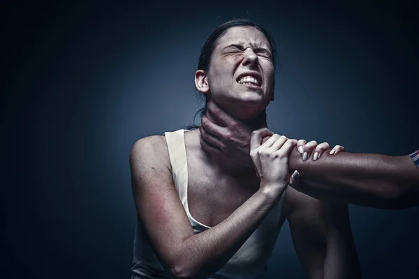 Home violence - young woman is choked by mans hand — Stock Photo, Image