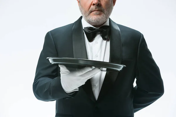 Senior waiter holding tray — Stock Photo, Image