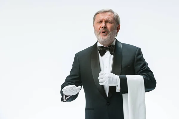 Senior waiter holding white towel — Stock Photo, Image