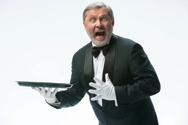 Senior waiter holding tray — Stock Photo, Image