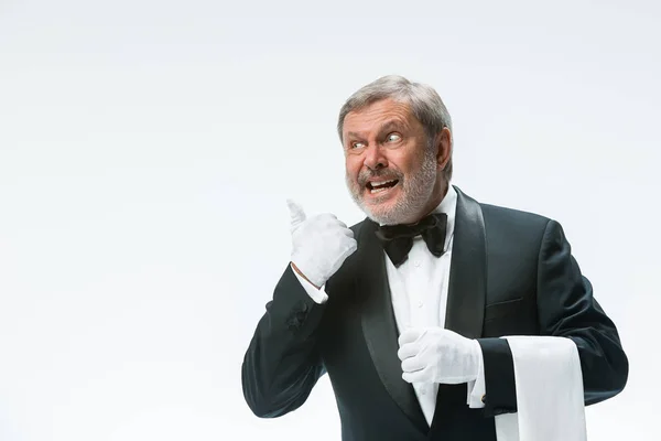 Senior waiter holding white towel — Stock Photo, Image