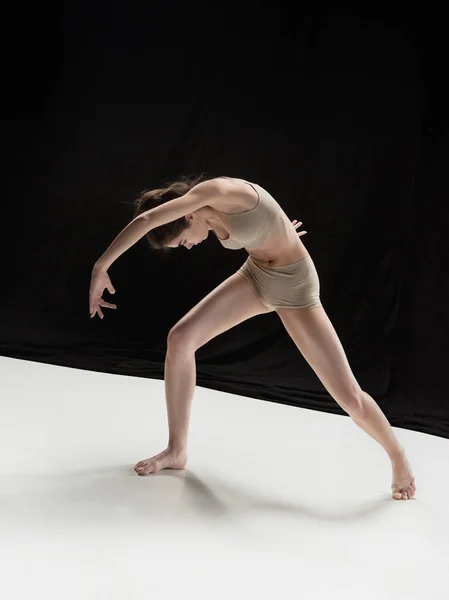 Young teen dancer on white floor background. — Stock Photo, Image