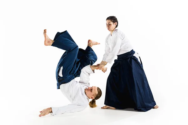 Man and woman fighting at Aikido training in martial arts school — Stock Photo, Image