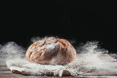 Fresh bread on table close-up clipart