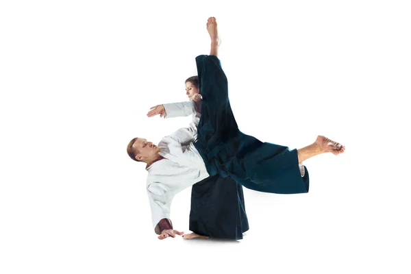 Man and woman fighting at Aikido training in martial arts school — Stock Photo, Image