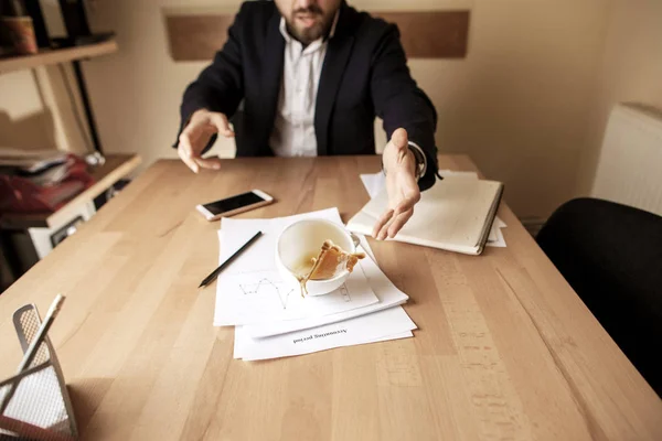 Coffee in white cup spilling on the table in the morning working day at office table — Stock Photo, Image