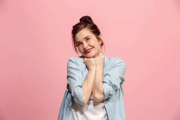 The happy business woman standing and smiling against pink background. — Stock Photo, Image