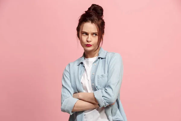 Suspiciont. Doubtful pensive woman with thoughtful expression making choice against pink background — Stock Photo, Image