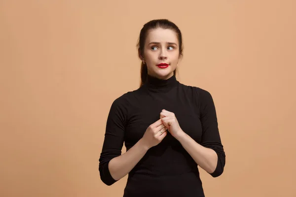 Let me think. Doubtful pensive woman with thoughtful expression making choice against pastel background — Stock Photo, Image