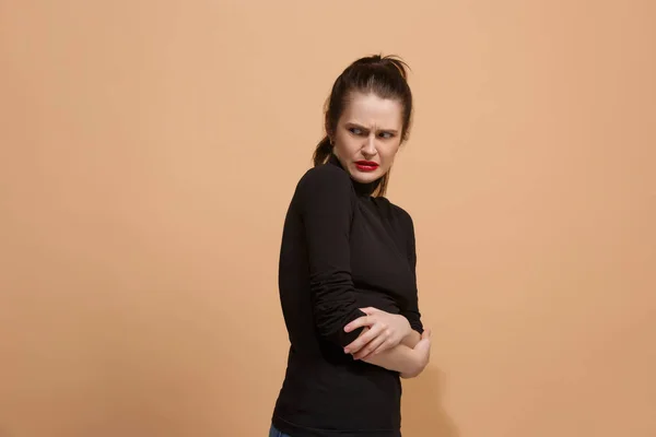 Young woman with disgusted expression repulsing something, isolated on the pastel — Stock Photo, Image
