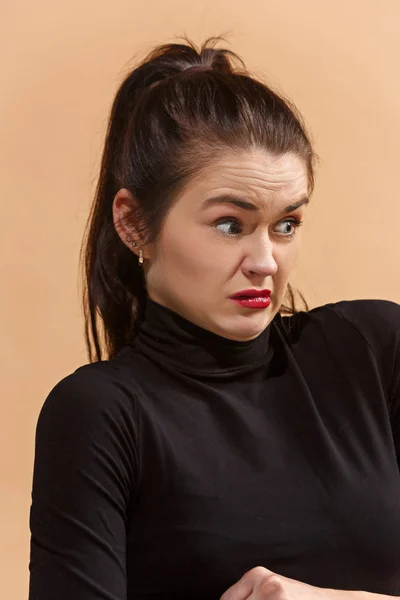 Young woman with disgusted expression repulsing something, isolated on the pastel — Stock Photo, Image