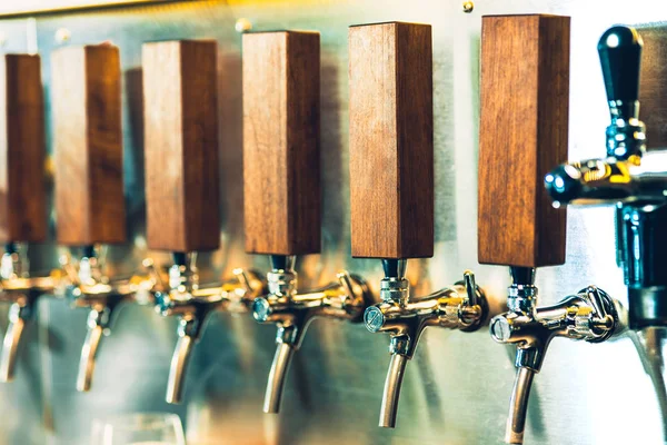 Beer taps in a pub — Stock Photo, Image