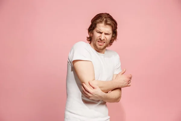 Young man with disgusted expression repulsing something, isolated on the pink — Stock Photo, Image