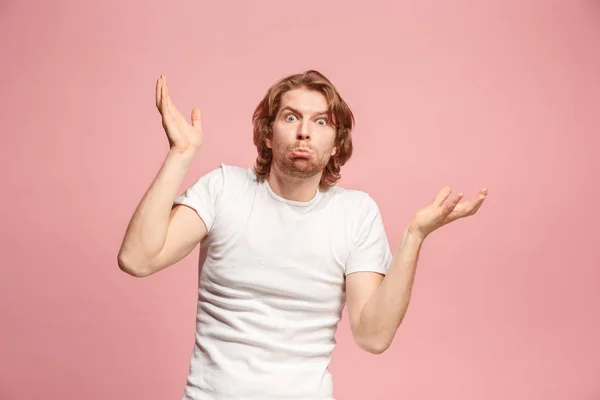 stock image Beautiful man looking suprised and bewildered isolated on pink