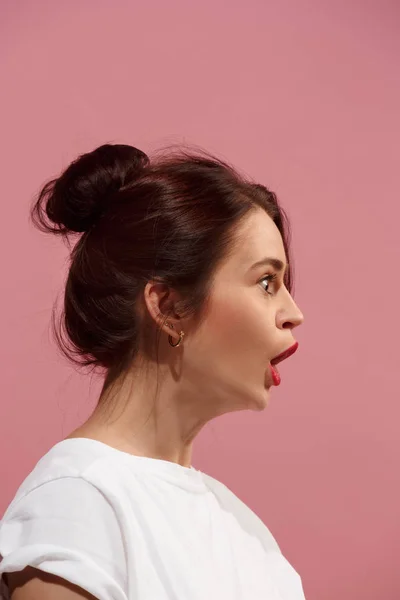 Beautiful woman looking suprised isolated on pink — Stock Photo, Image