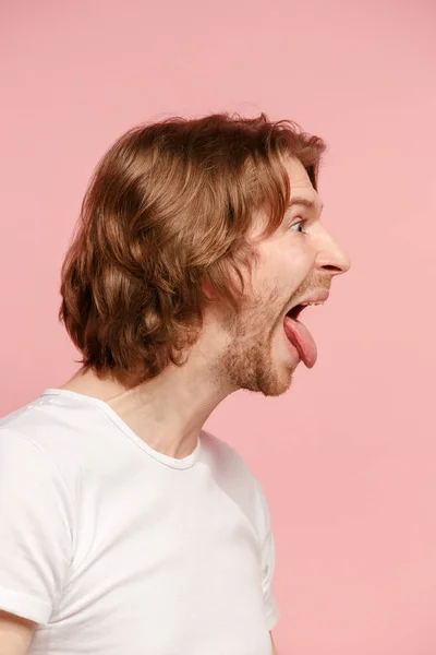 The man with crazy expression isolated on pink — Stock Photo, Image