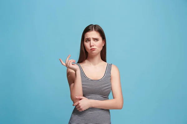 Let me think. Doubtful pensive woman with thoughtful expression making choice against blue background — Stock Photo, Image