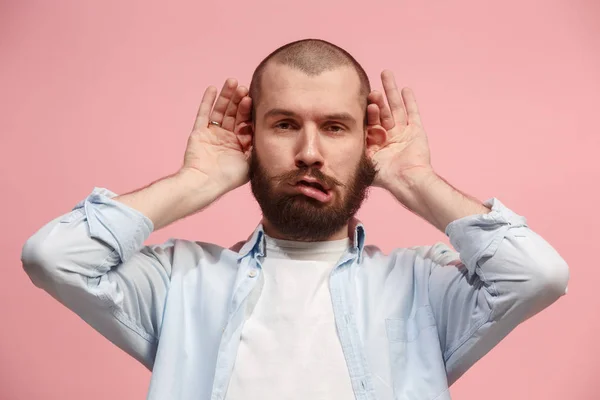 Der schielende Mann mit seltsamem Gesichtsausdruck isoliert auf rosa — Stockfoto