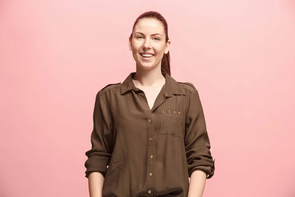 The happy business woman standing and smiling against pink background. — Stock Photo, Image