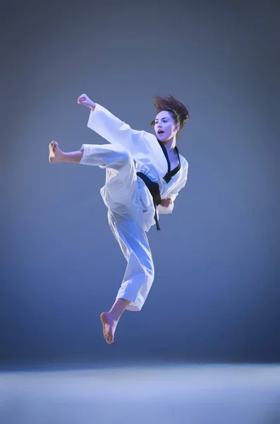 The karate girl with black belt — Stock Photo, Image