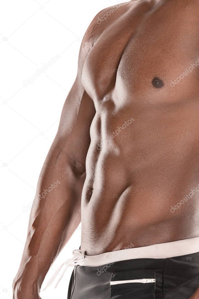 Fit young man with beautiful torso isolated on white background