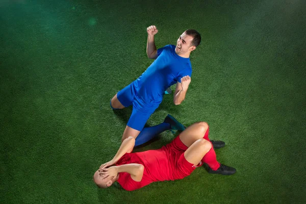 Happy and unhappy football players after goal — Stock Photo, Image