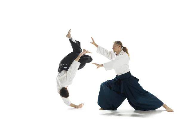 The two men fighting at Aikido training in martial arts school — Stock Photo, Image