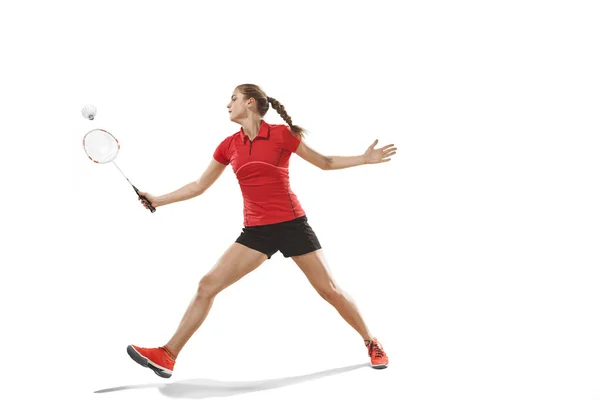 Junge Frau spielt Badminton auf weißem Hintergrund — Stockfoto