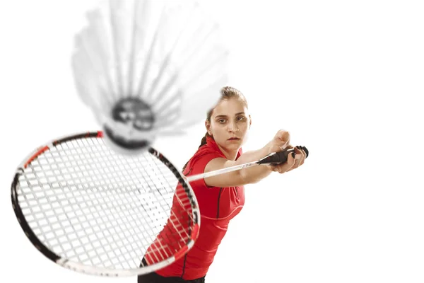 年轻女子在白色的背景打羽毛球 — 图库照片