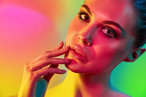 High Fashion model woman in colorful bright lights posing in studio — Stock Photo, Image