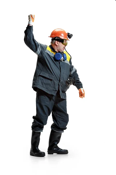 The studio shot of senior bearded male miner standing at the camera on a white background. — Stock Photo, Image