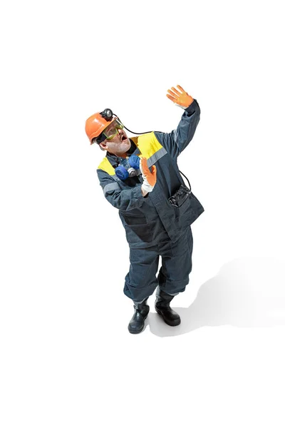 The studio shot of senior bearded male miner standing at the camera on a white background. — Stock Photo, Image