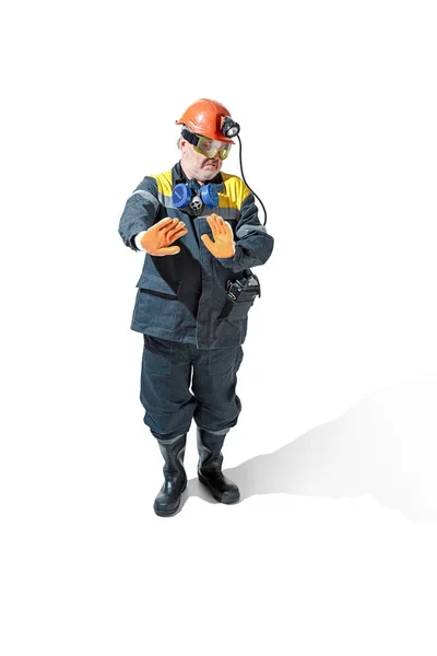 The studio shot of senior bearded male miner standing at the camera on a white background. — Stock Photo, Image