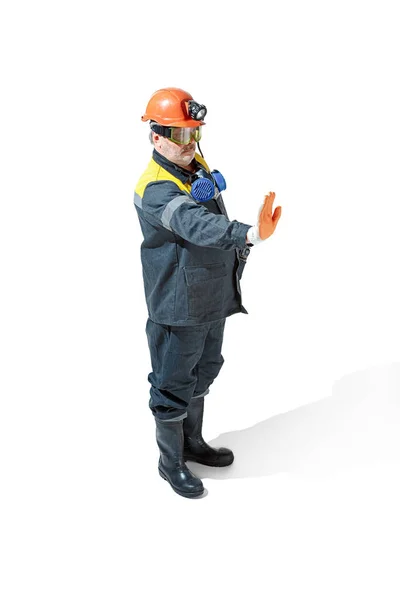 The studio shot of senior bearded male miner standing at the camera on a white background. — Stock Photo, Image