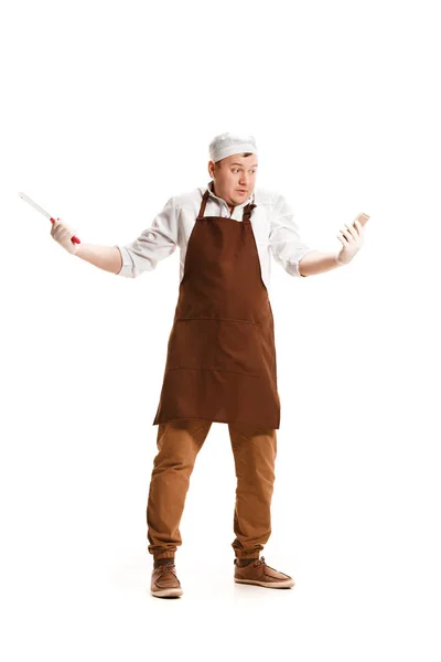 Smiling butcher posing with a cleaver isolated on white background — Stok Foto