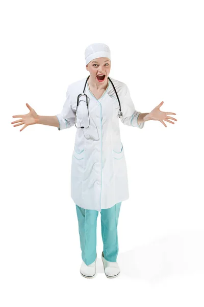 Beautiful young woman is surprised in white coat posing at studio. Full length studio shot isolated on white. — Stock Photo, Image